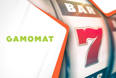 Das Gamomat Logo und ein Slot Symbol.